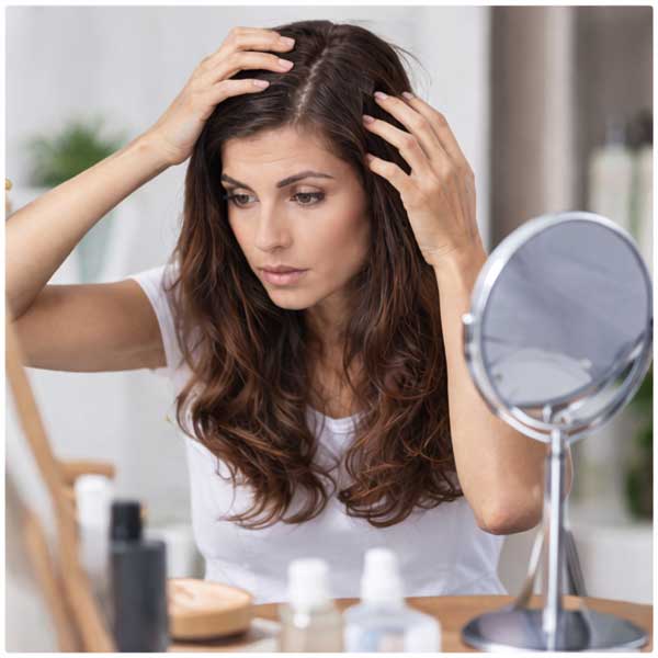 woman checking her hair and scalp
